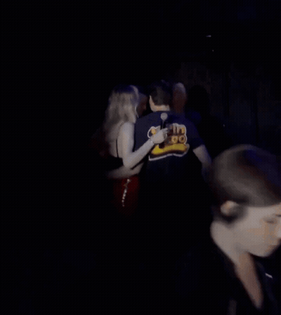 Woman With Eyes Closed Holding Shoulder GIF