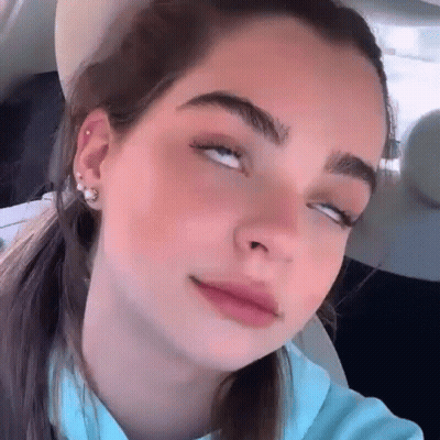 Woman With Eyes Closed In Car GIF
