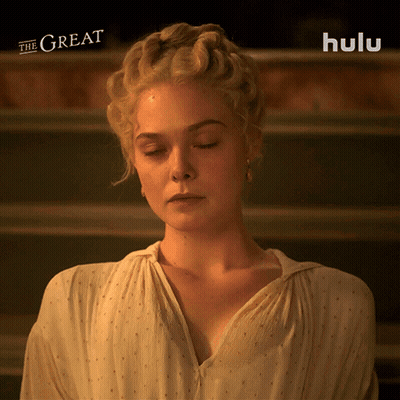 Woman With Eyes Closed In Front Of Hulu Logo GIF