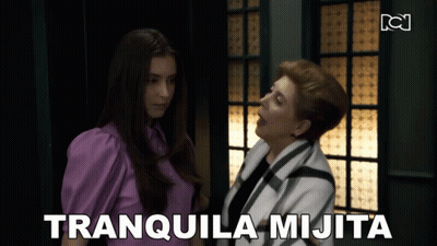 Woman With Eyes Closed Looking At Another Woman GIF