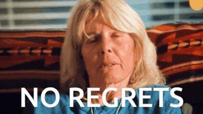 Woman With Eyes Closed Saying No Regrets GIF