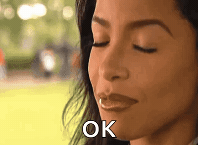 Woman With Eyes Closed Saying OK GIF