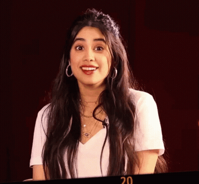 Woman With Eyes Closed Wearing Hoop Earrings And 20 Necklace GIF
