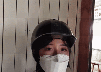 Woman With Face Mask and Helmet