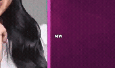 Woman With Face Shield Laughing Holding Microphone GIF