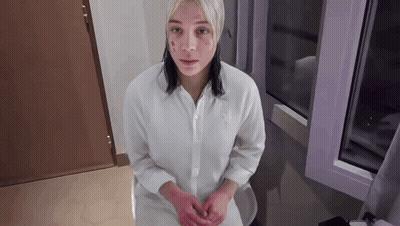 Woman With Face Tattoo Sitting On Toilet GIF