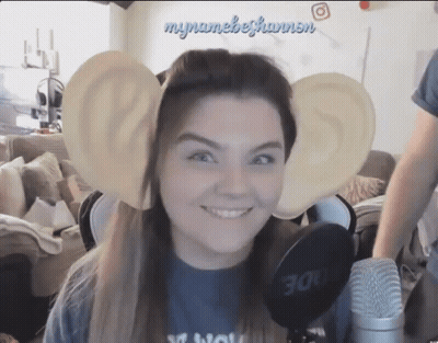 Woman With Fake Ears Smiling At Microphone GIF