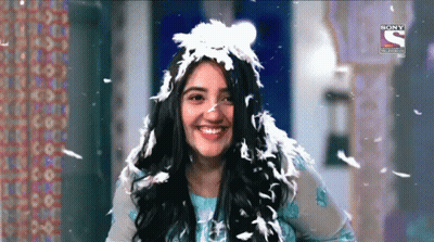 Woman With Feather Headpiece Smiling GIF