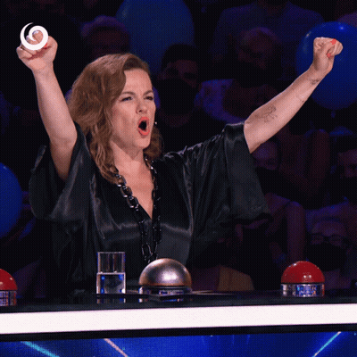 Woman With Fist In Air And Glass Of Water GIF