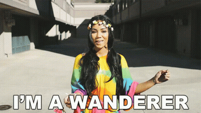 Woman With Flower Crown Saying I'm A Wanderer GIF