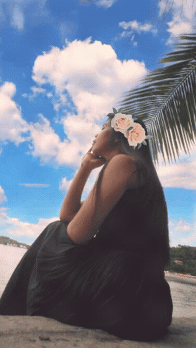 Woman With Flower Crown Sitting Beach GIF