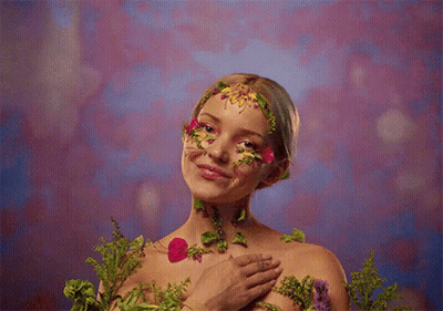 Woman With Flower Face Paint GIF