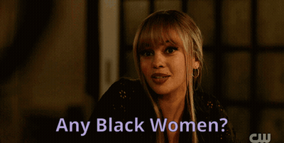 Woman With Flower In Hair Asking About Black Women GIF