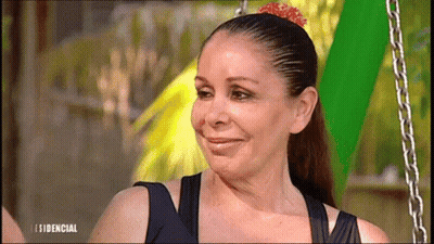 Woman With Flower In Hair Smiling At Residencial Screen GIF