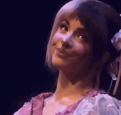 Woman With Flower In Hair Smiling GIF