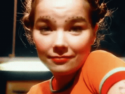 Woman With Forehead Tattoo And Red Shirt GIF