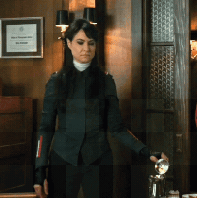 Woman With Framed Certificate Saying John A. Johnson GIF