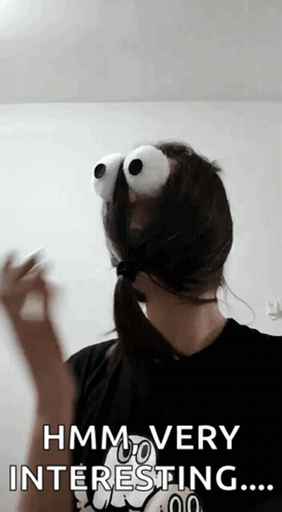 Woman With Giant Googly Eyes Says Hmm Interesting GIF