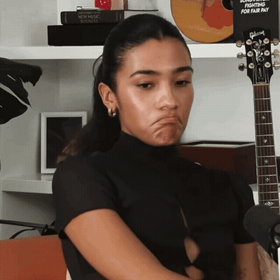 Woman With Gibson Guitar Making Face GIF