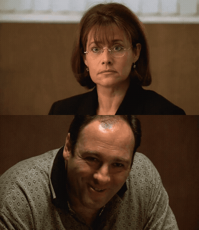 Woman With Glasses And Bald Man GIF