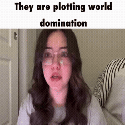 Woman With Glasses And Bandage Plotting World Domination GIF