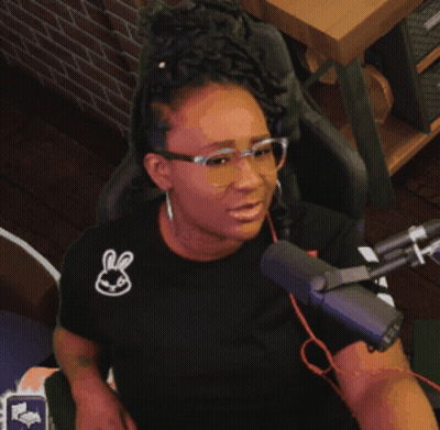 Woman With Glasses And Bunny Shirt At Microphone GIF
