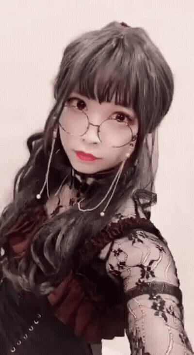 Woman With Glasses And Choker Taking Selfie GIF