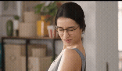 Woman With Glasses And Grey Tank Top GIF