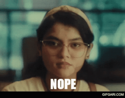 Woman With Glasses And Headband Making Funny Face Nope GIF