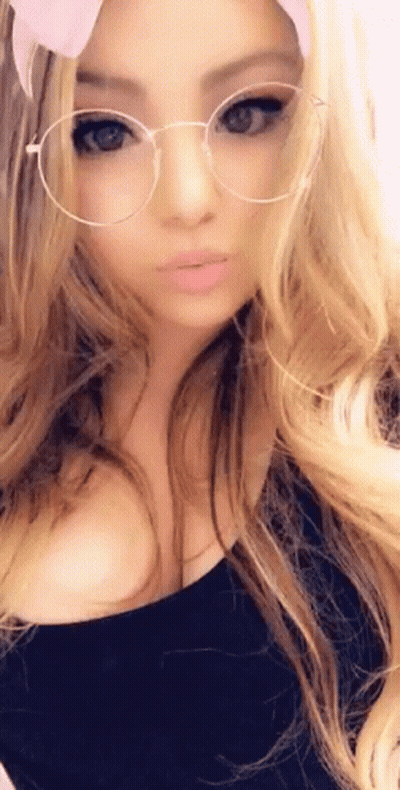 Woman With Glasses And Headband Taking Selfie GIF