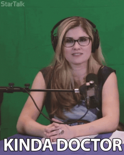 Woman With Glasses And Headphones In Front Of Green Screen Saying Kinda Doctor GIF
