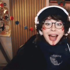 Woman With Glasses And Headphones Smiling Blood On Face GIF