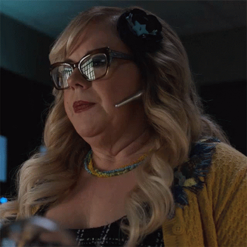 Woman With Glasses And Headset Looks At Something GIF