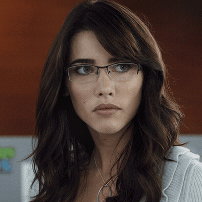 Woman With Glasses And Necklace Looks Serious GIF