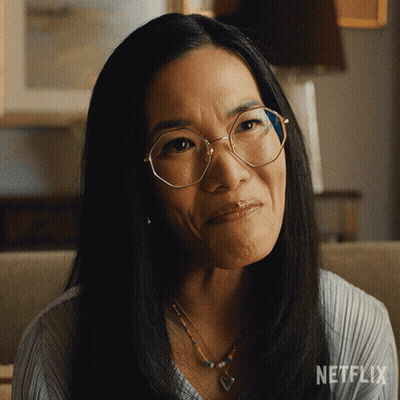 Woman With Glasses And Necklace Netflix Logo GIF