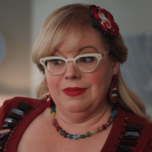 Woman With Glasses And Necklace Smiling GIF