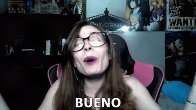 Woman With Glasses And Purple Lipstick Says Bueno Near Wanted Poster GIF
