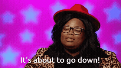 Woman With Glasses And Red Hat Says It's About To Go Down GIF