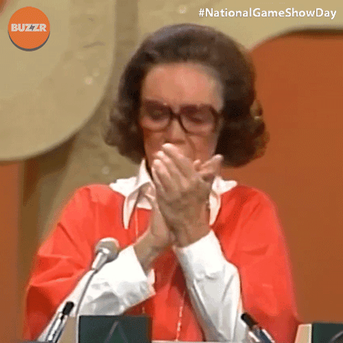 Woman With Glasses And Red Shirt Clapping In Front Of Microphone GIF