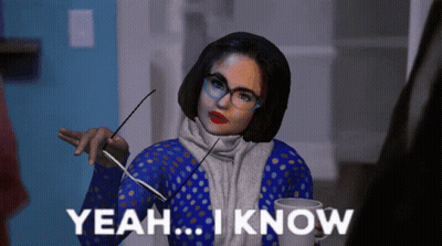 Woman With Glasses And Scarf Holding Cup Saying Yeah I Know GIF