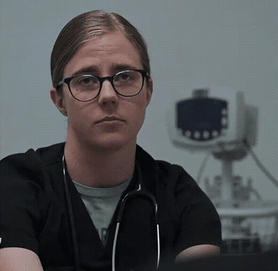 Woman With Glasses And Stethoscope Looking At Camera GIF
