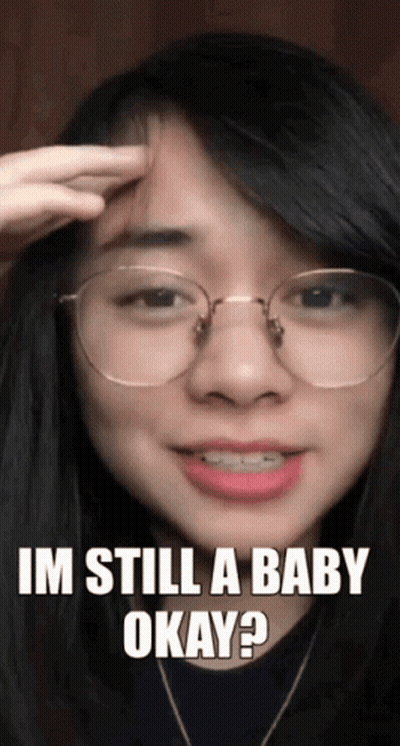 Woman With Glasses Asking If She's Still A Baby GIF
