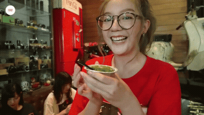 Woman With Glasses Holding Green Drink GIF