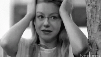 Woman With Glasses Holding Head GIF