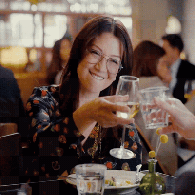 Woman With Glasses Holding Wine GIF