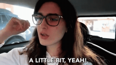Woman With Glasses In Car Saying A Little Bit Yeah GIF