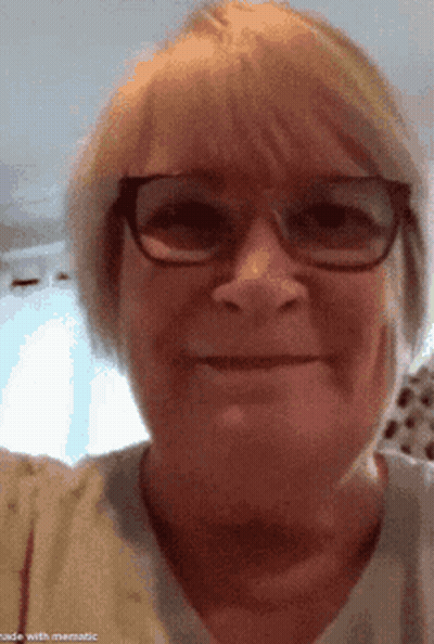 Woman With Glasses In White Shirt Smiling GIF