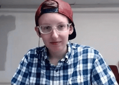Woman With Glasses Looking At Camera GIF