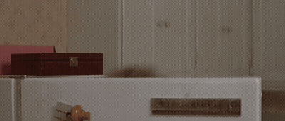 Woman With Glasses Looking Out Window GIF