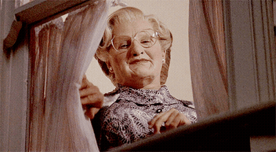 Woman With Glasses Looking Out Window GIF